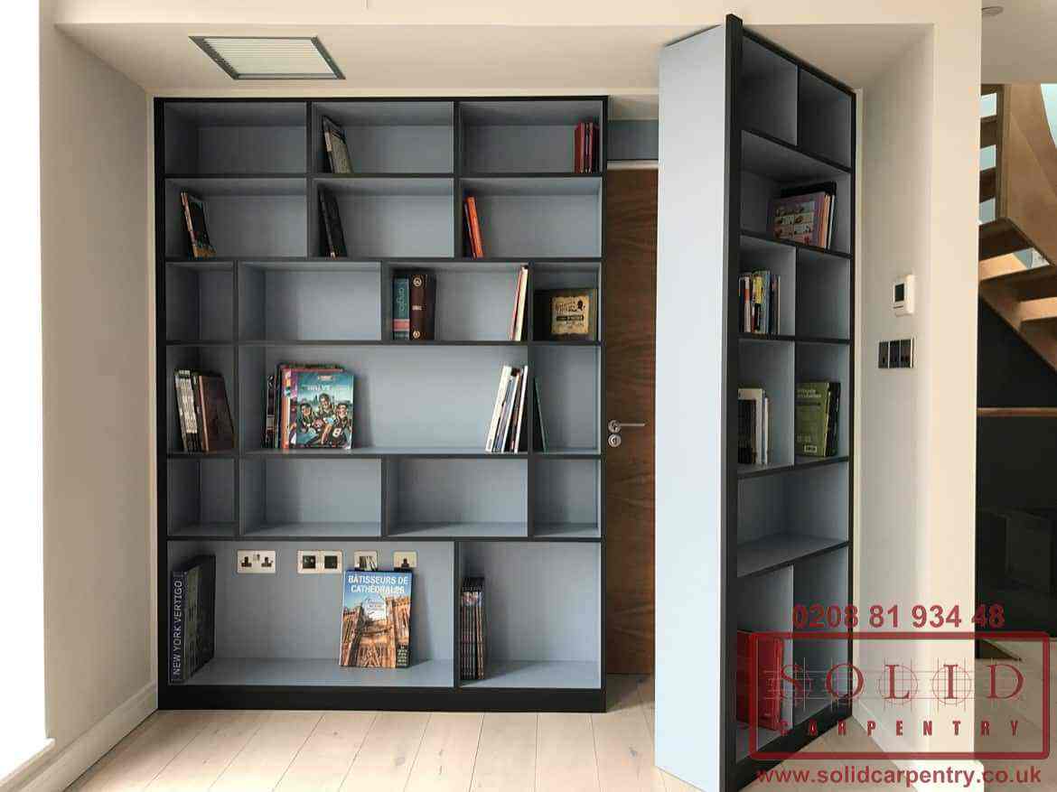 Photo of a bookcase opening to reveal it is in fact a door